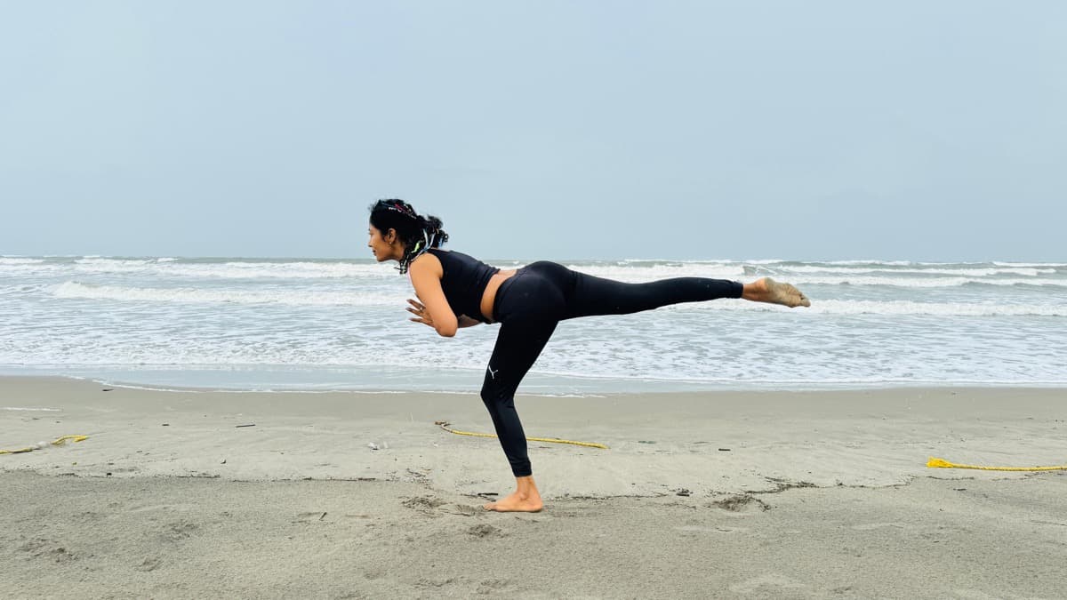 Warrior III balance pose at sunrise